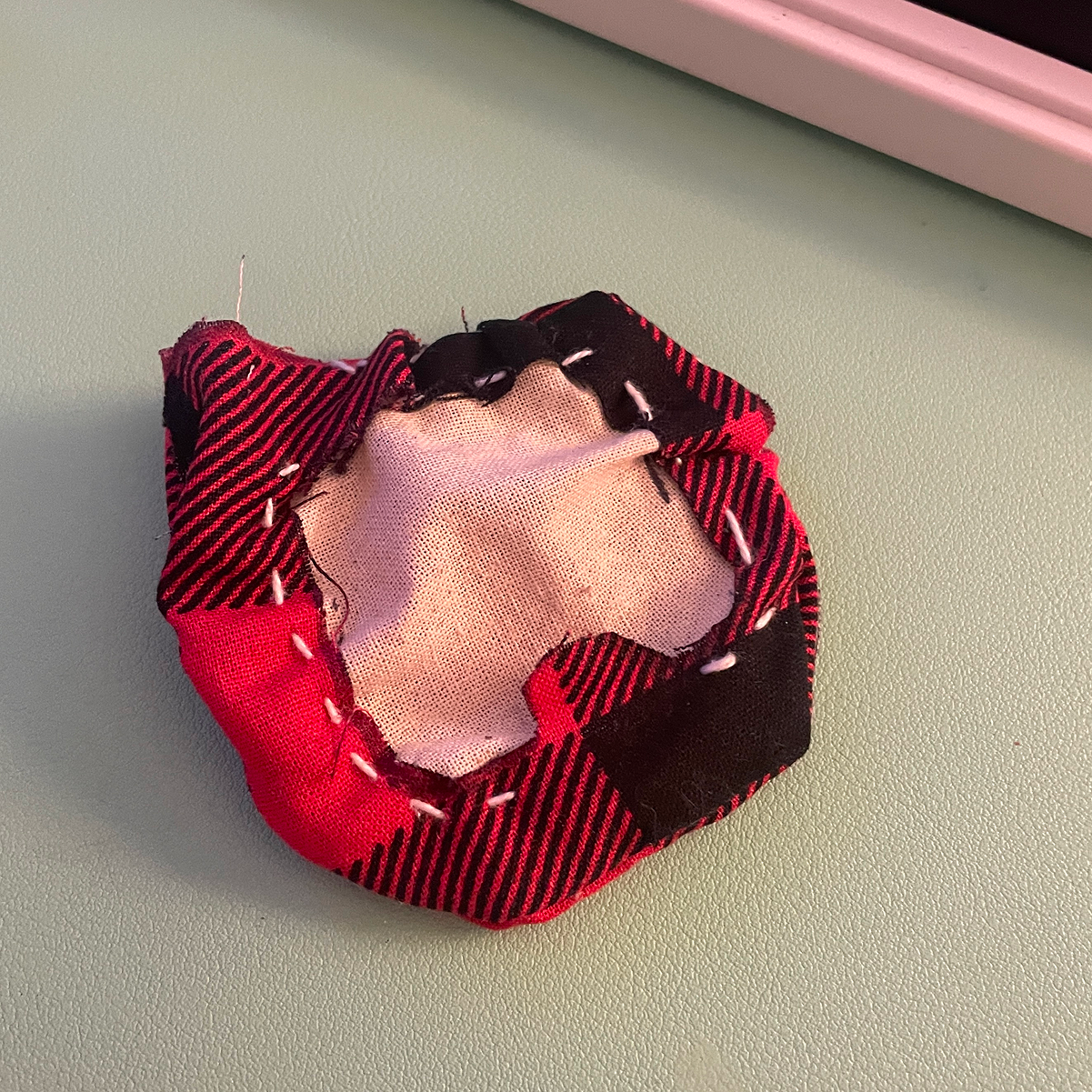 This is Nicole's badge prototype. She did a fantastic job considering it was her first time sewing. We used scrap fabric for the tester then planned to use coloured fabric for the final.